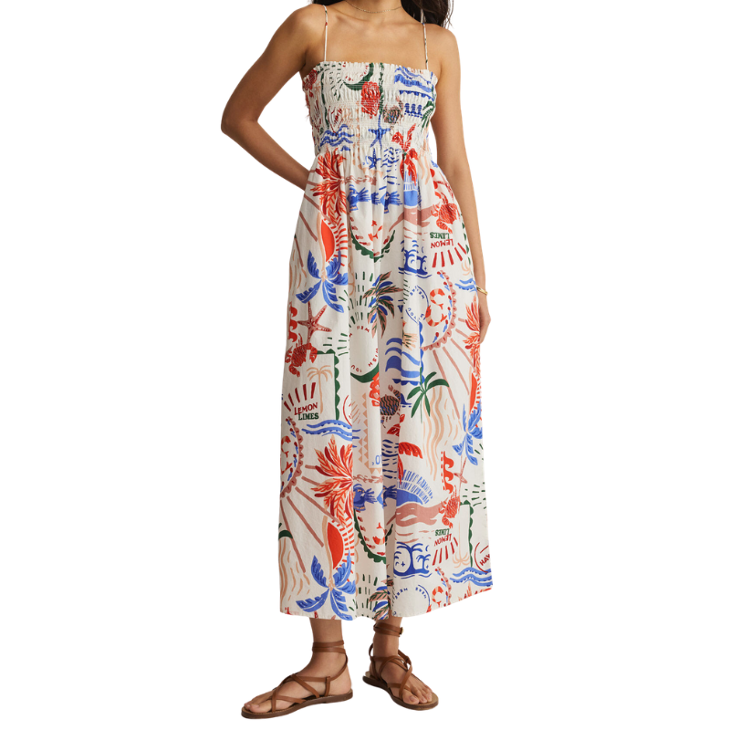 Woman wearing a colorful floral dress on a white background