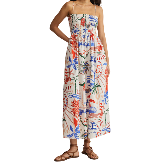 Woman wearing a colorful floral dress on a white background