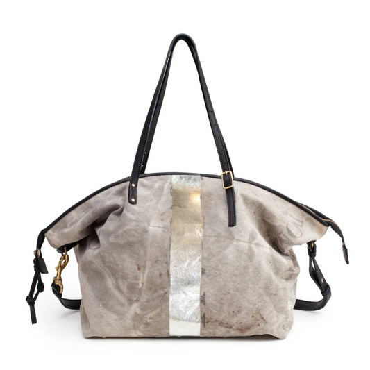 Handbag with metallic stripe on a white background