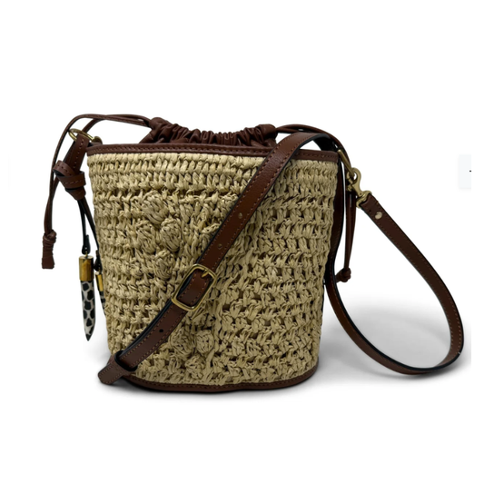Crocheted bag with a brown leather strap on a white background