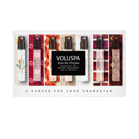 Set of Voluspa eau de parfum bottles in a display case on a white background