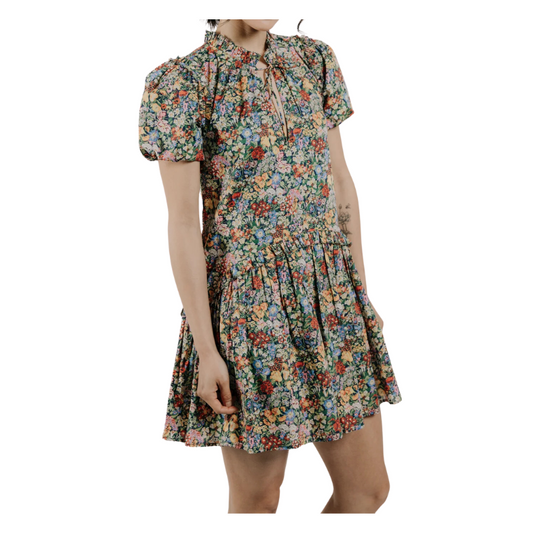 Floral dress worn by a person on a white background
