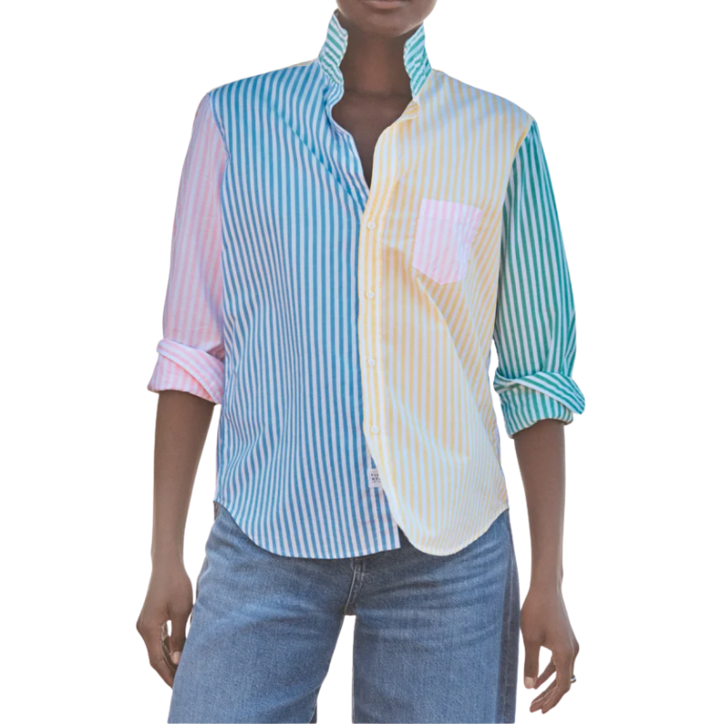 Person wearing a layered shirt with blue, white, and pink stripes on a white background