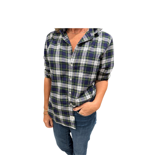 Person wearing a plaid shirt with rolled-up sleeves on a white background