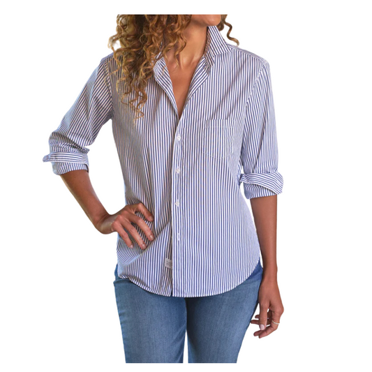 Woman wearing a blue and white striped shirt with rolled-up sleeves on a white background