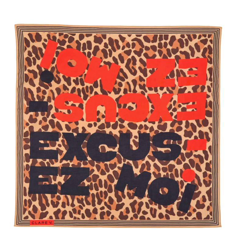 Leopard print scarf with text 'EXCUS- EZ MOI' in red and black on a beige background