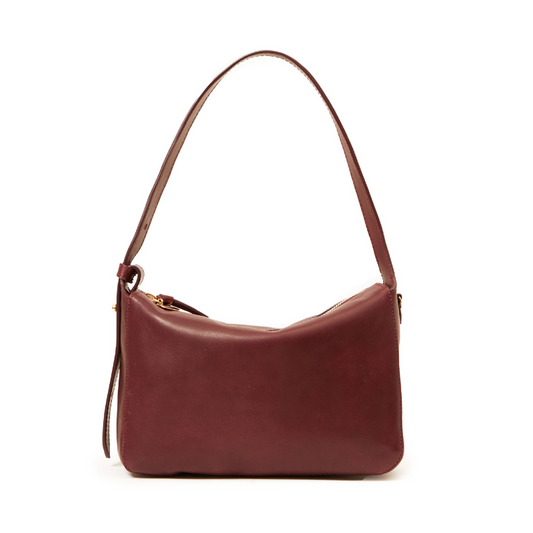 Brown leather handbag on a white background