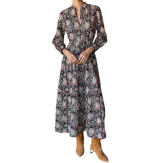 Floral patterned dress worn by a person on a white background
