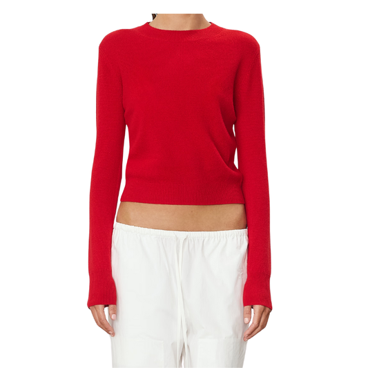 Red sweater worn by a person on a white background