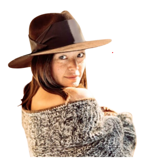 Woman wearing a brown hat and off-shoulder sweater on a white background