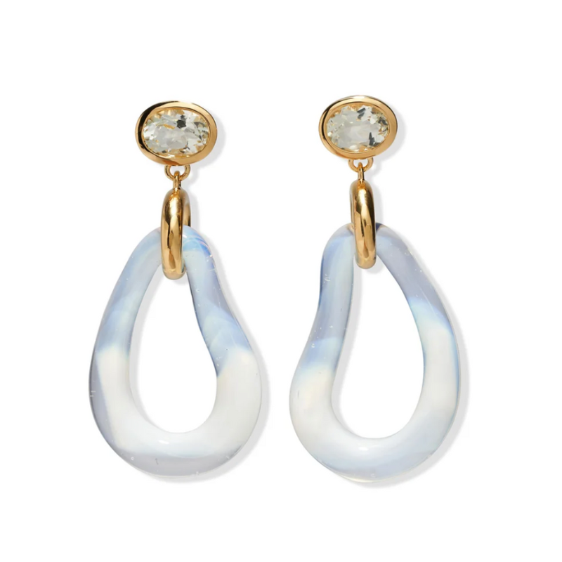 Pair of earrings with gold accents and white teardrop-shaped stones on a white background