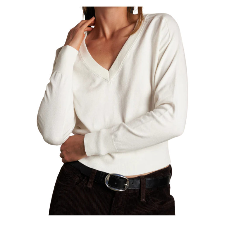 White sweater worn by a person on a white background