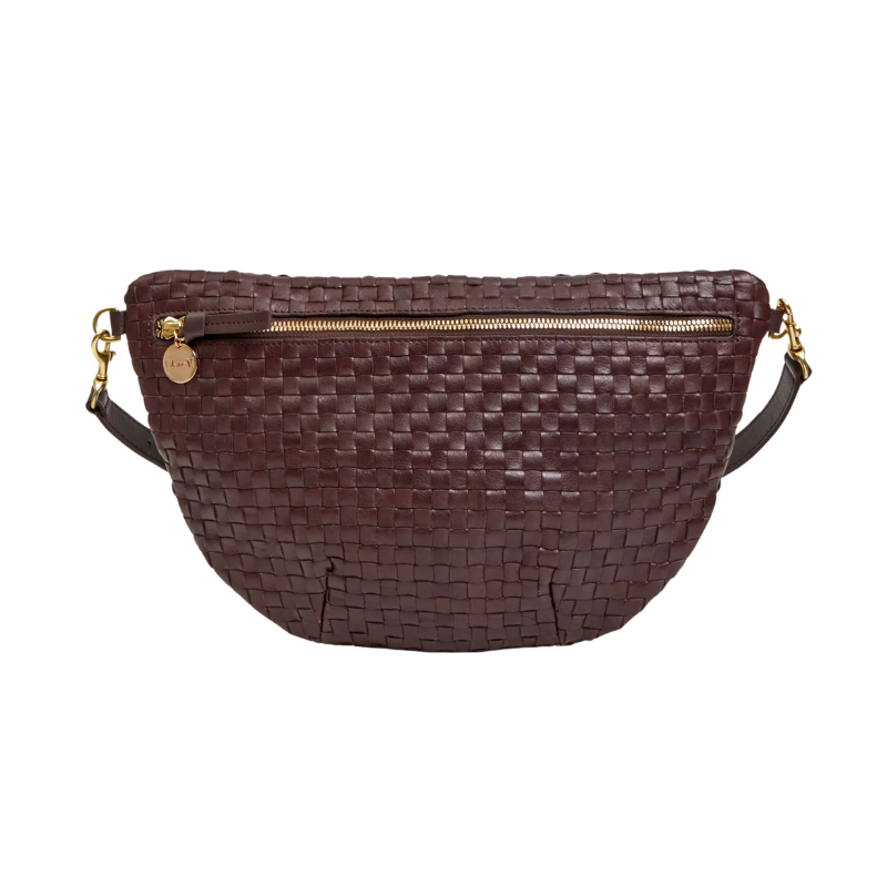 Brown woven handbag with gold zipper on a white background