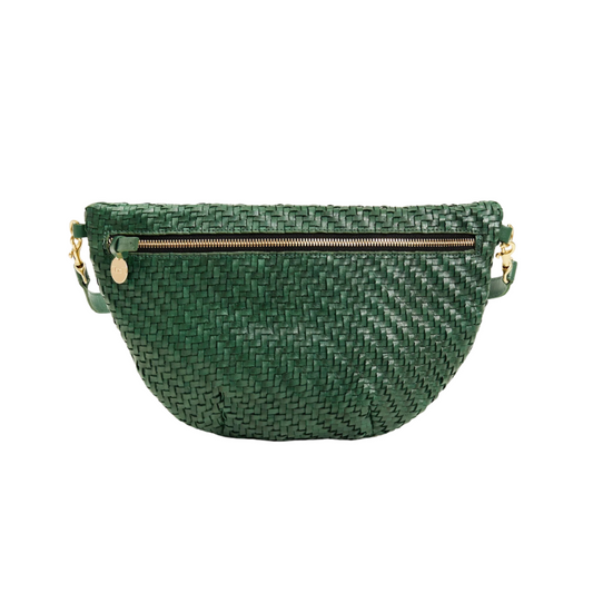 Green woven handbag with gold zipper and handle on a white background