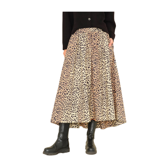 Leopard print skirt worn by a person on a white background