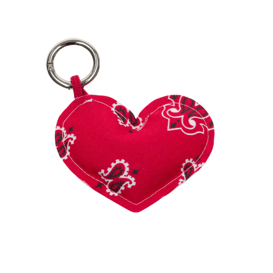 Red heart-shaped keychain with bandana pattern on a white background