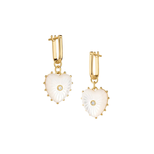 Heart-shaped earrings with gold hooks and white stones on a white background