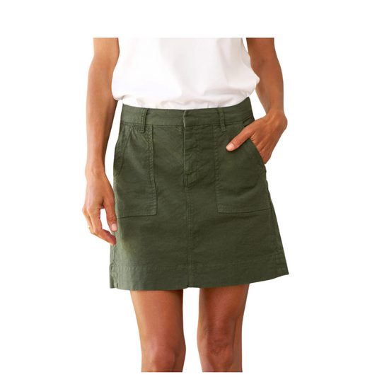 Green skirt worn by a person on a white background