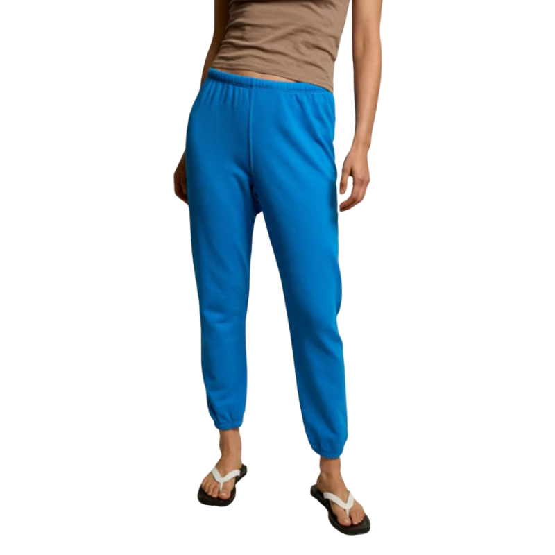 Person wearing blue pants on a white background