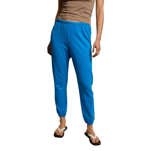 Person wearing blue pants on a white background