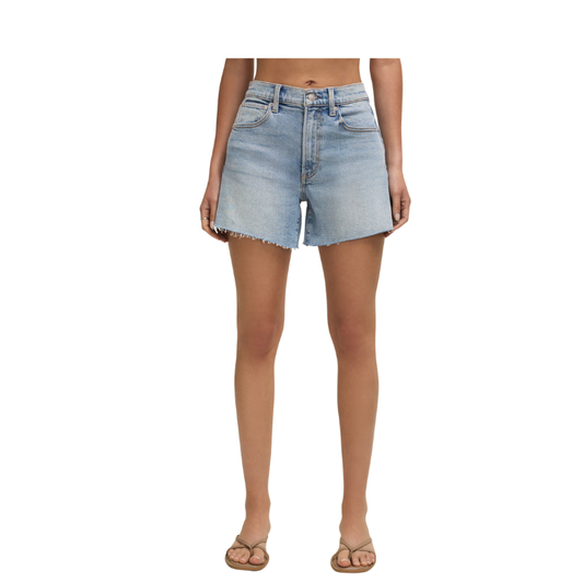 Light blue denim shorts worn by a person on a white background