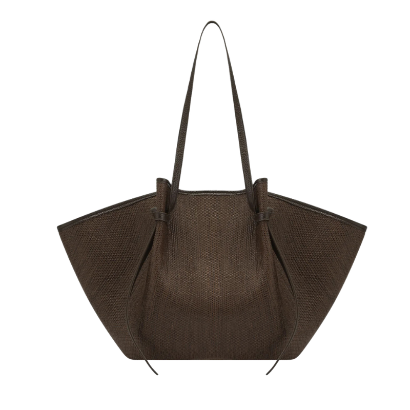 Brown textured handbag on a white background