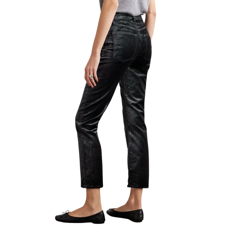 Person wearing black jeans on a white background