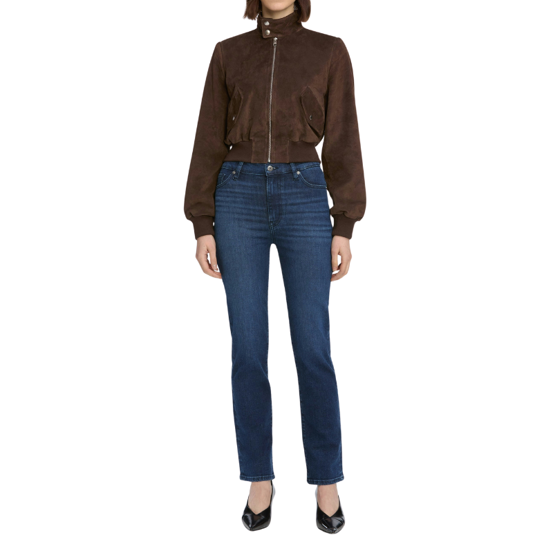 Person wearing a brown suede jacket and blue jeans on a white background