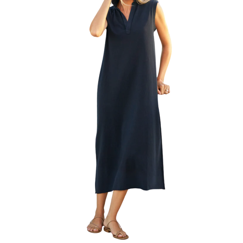 Woman wearing a navy sleeveless dress on a white background