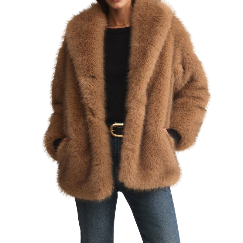 Brown fluffy coat worn by a person on a white background