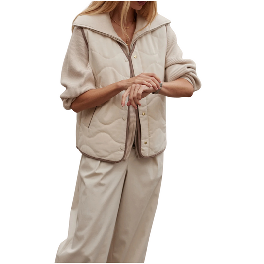 Beige quilted jacket and pants set on a white background