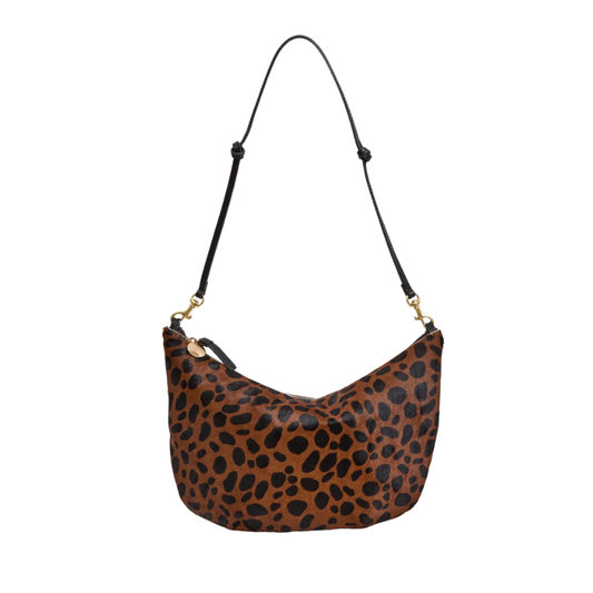 Leopard print handbag with a black strap on a white background
