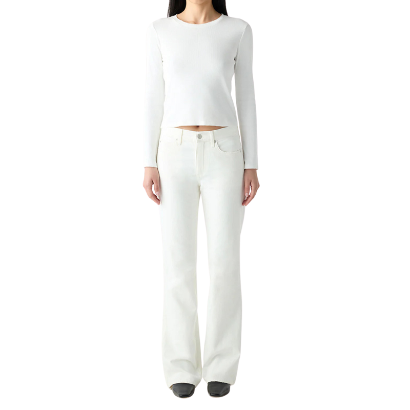 Person wearing a white long-sleeve top and white pants on a white background
