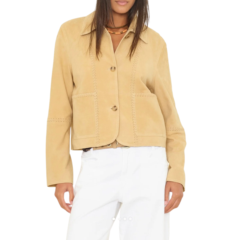 Beige jacket worn by a person on a white background