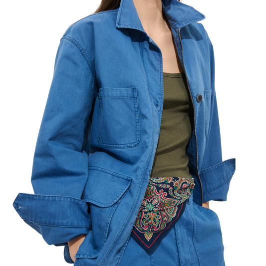 Blue jacket with a colorful patterned scarf draped over the shoulder on a white background