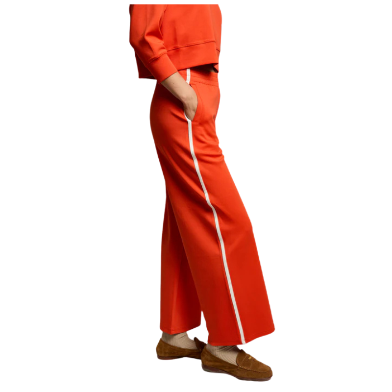 Orange pants with a white stripe on a white background