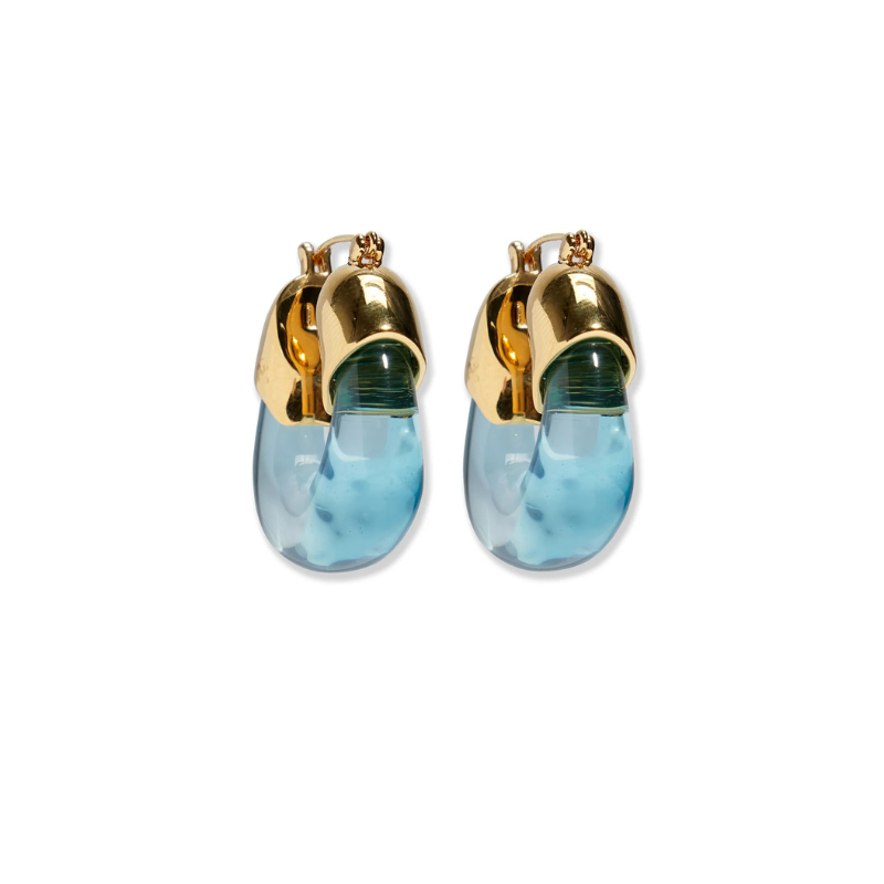 Gold and blue earrings on a white background