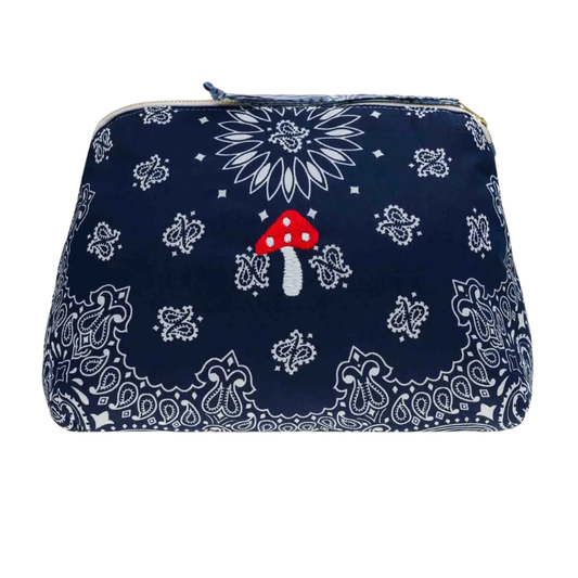 Navy blue pouch with white paisley patterns and a red mushroom design on a white background