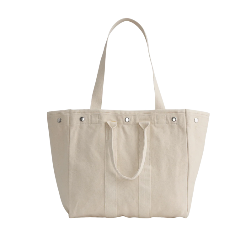 Beige tote bag with button details on a white background