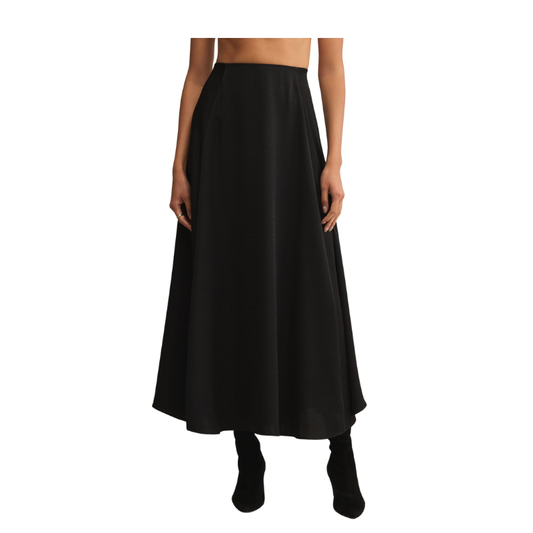 Black skirt worn by a person on a white background