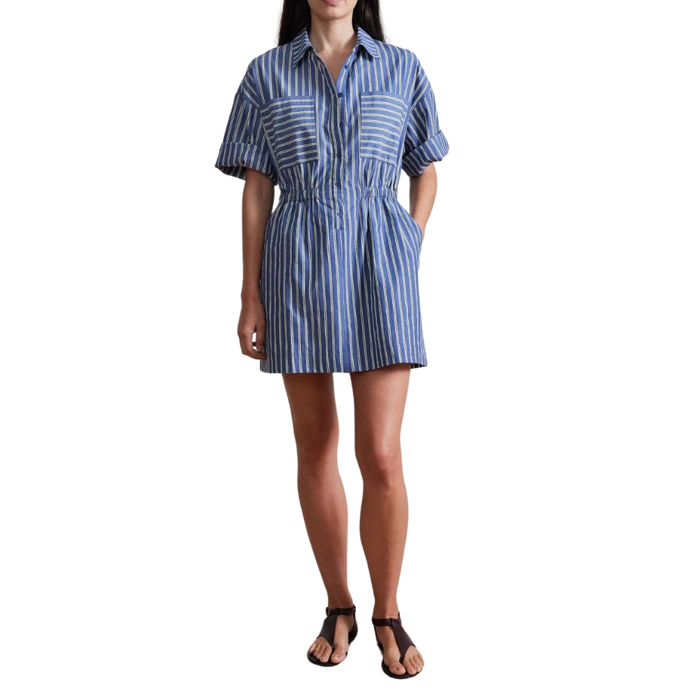 Woman wearing a blue and white striped dress on a white background