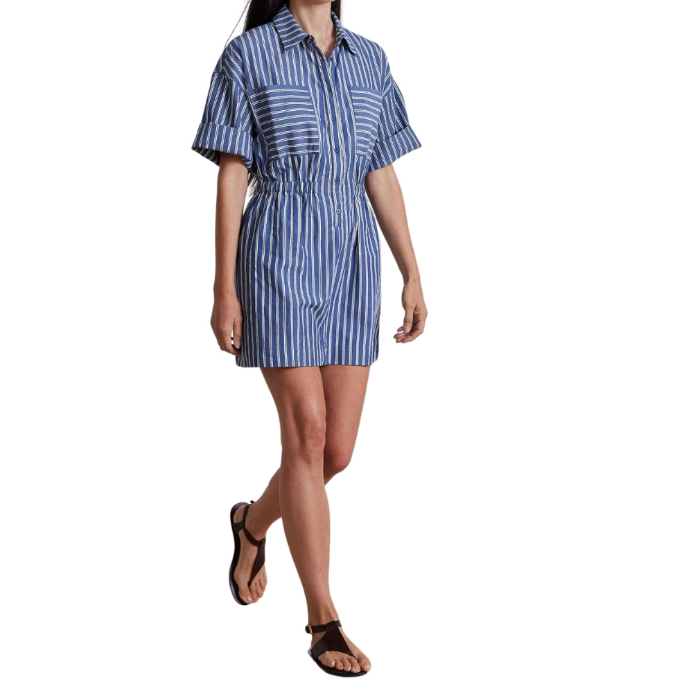 Woman wearing a blue and white striped dress on a white background