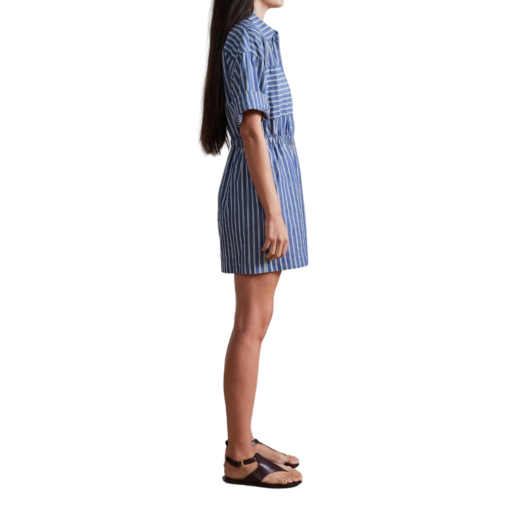 Woman wearing a blue and white striped dress on a white background