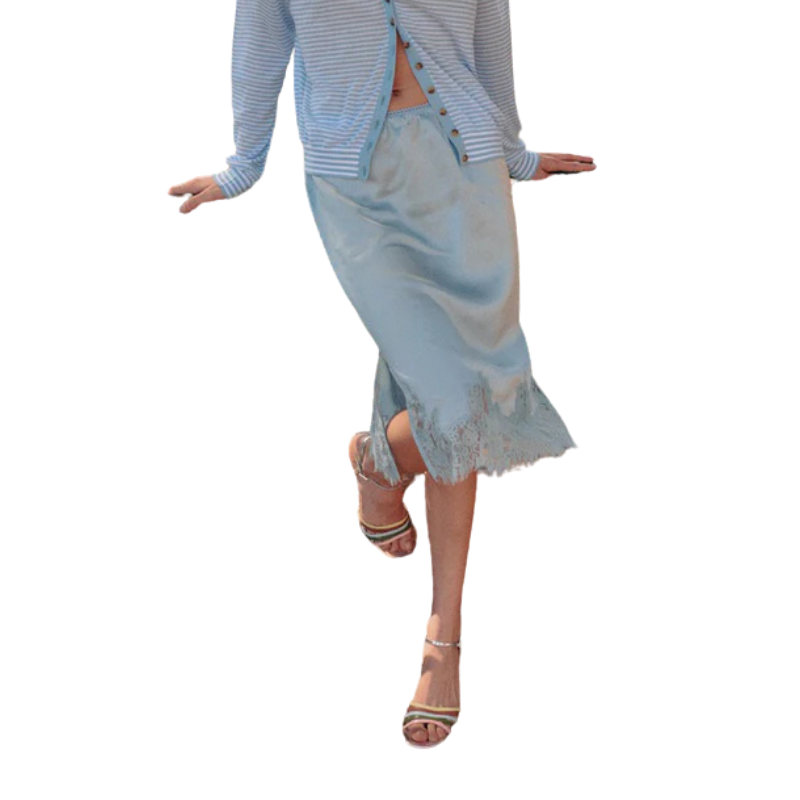 Light blue lace skirt worn by a person on a white background