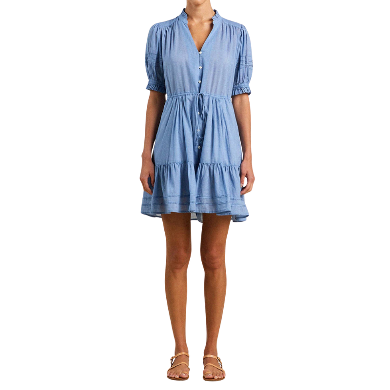 Woman wearing a blue dress on a white background