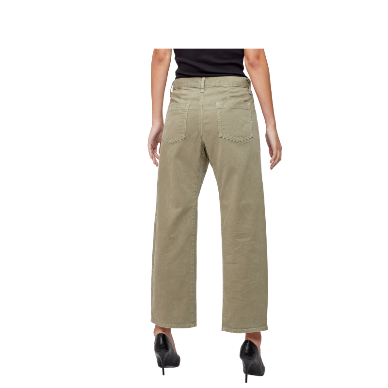 Beige pants worn by a person on a white background