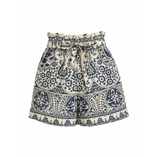 Navy and white patterned shorts on a white background