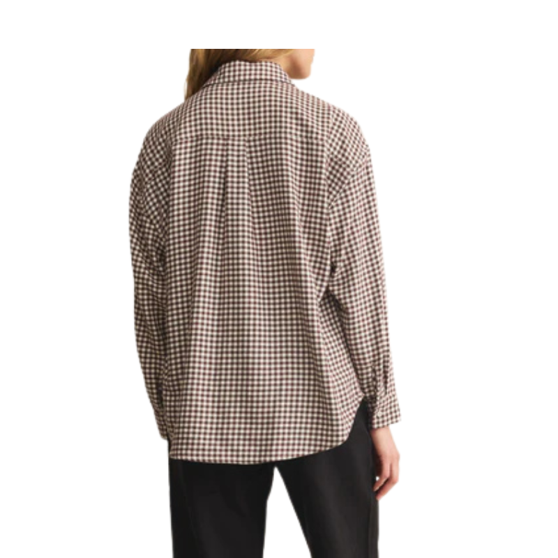 Person wearing a plaid shirt on a white background