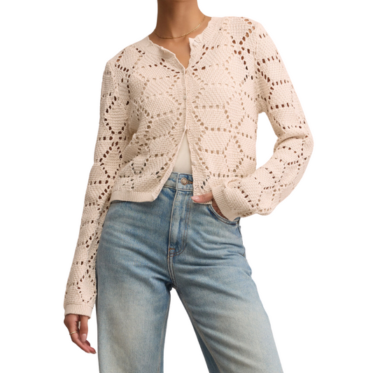 Beige lace cardigan worn by a person on a white background