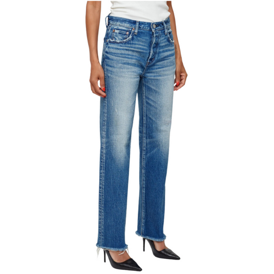 Blue jeans worn by a person on a white background